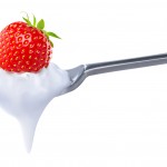 Spoon of strawberry yoghurt